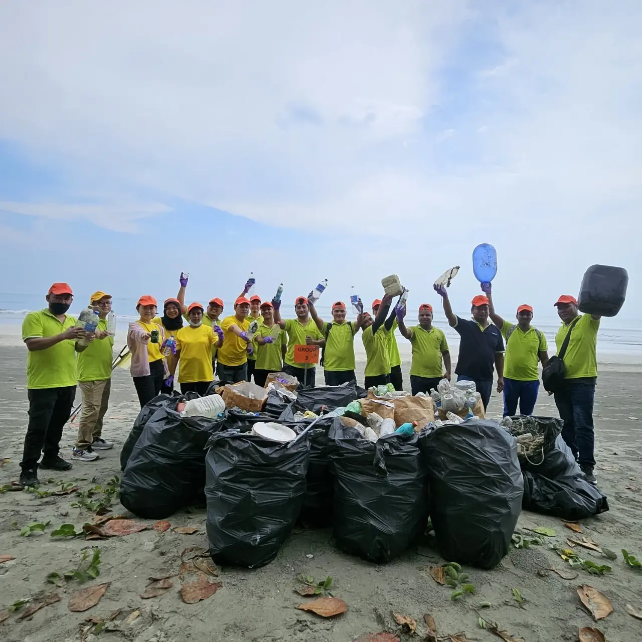 Beach cleanup team celebrating