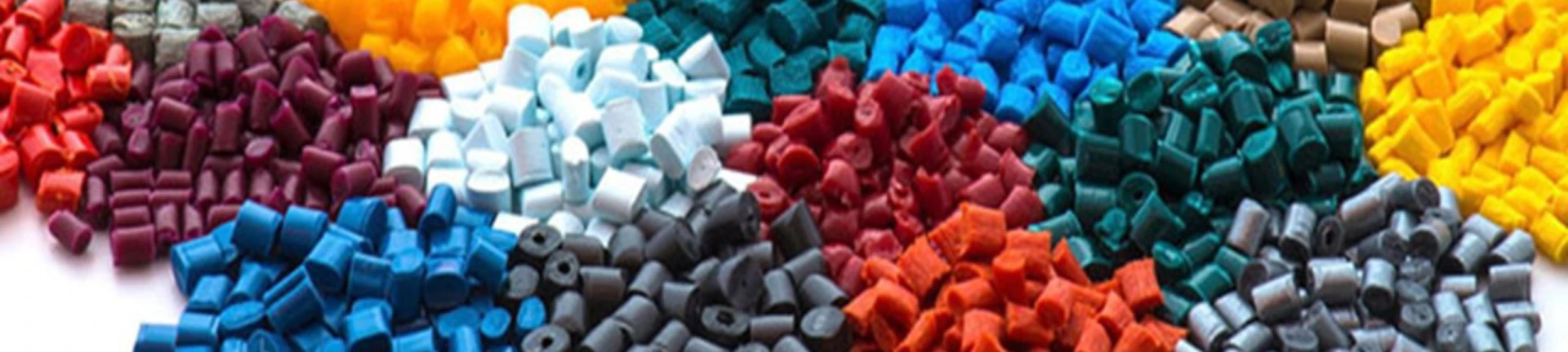 Various types of plastic resin pellets used in injection molding